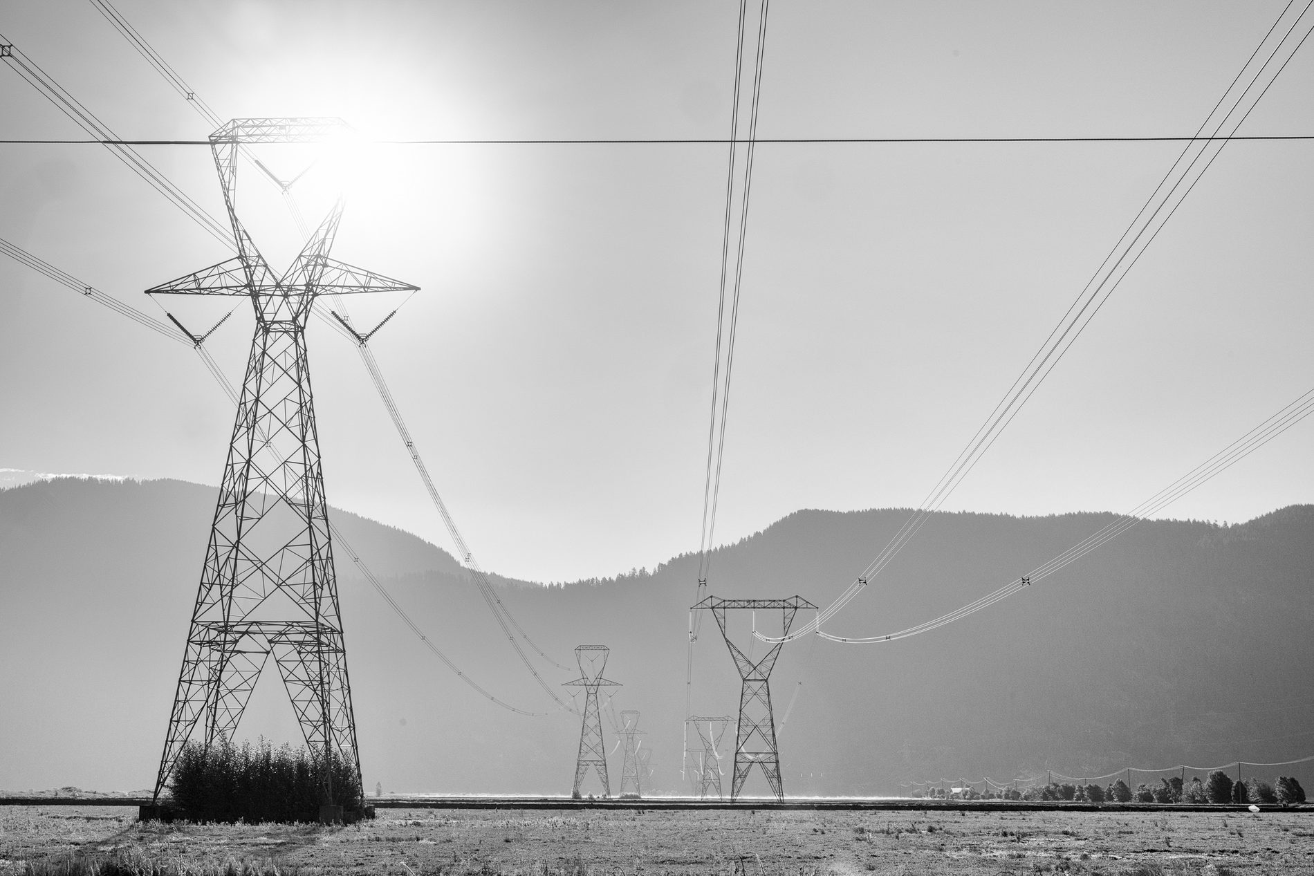 Power lines crossing a mountain landscape from The Architecture of Distance